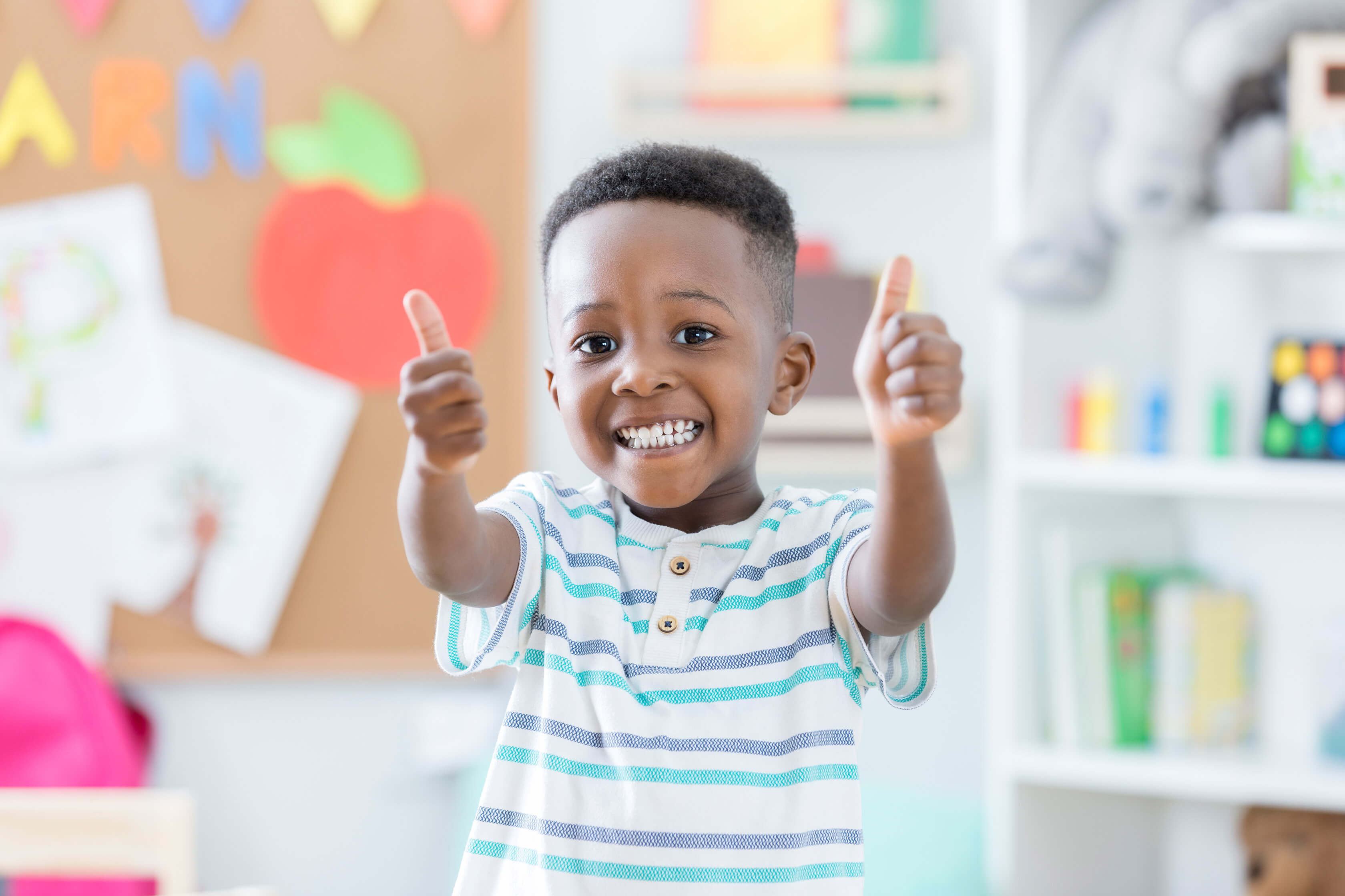 Student giving two thumbs up