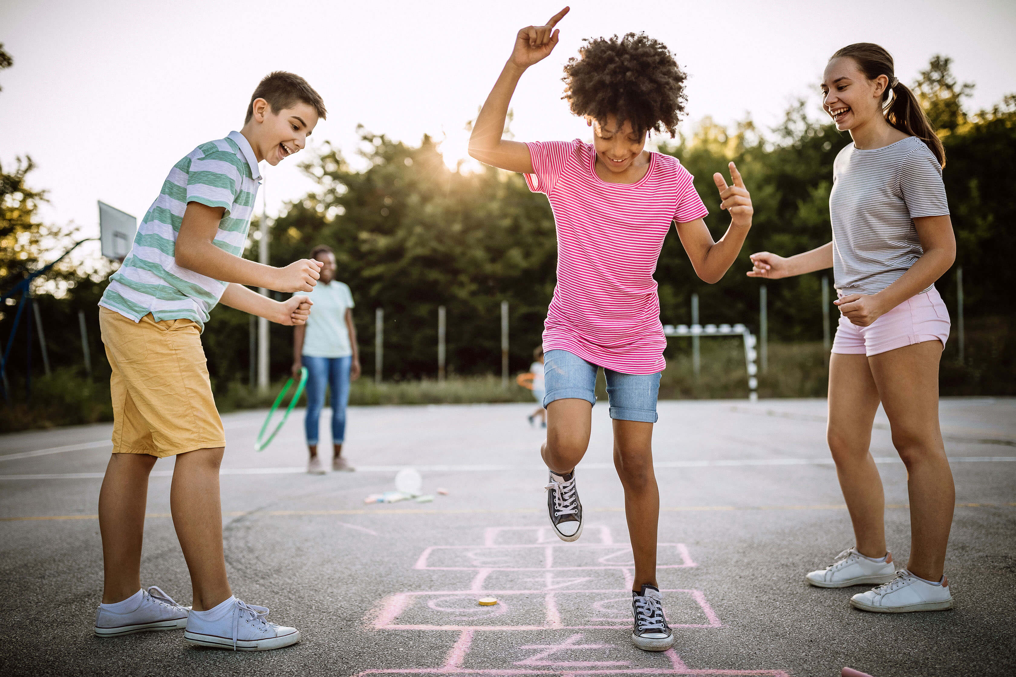 A group of students playing hopscotch outside