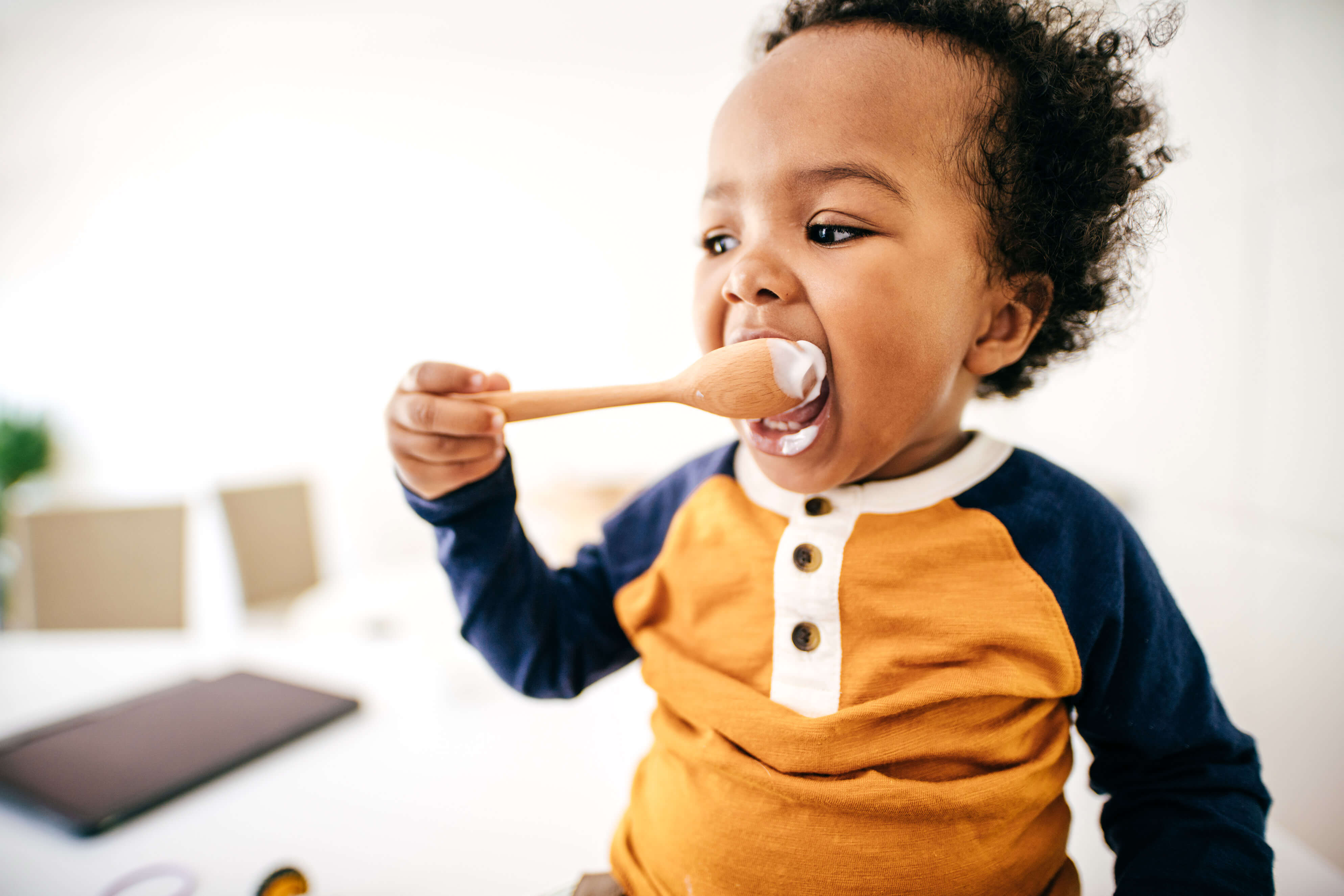 A child eating from a spoon